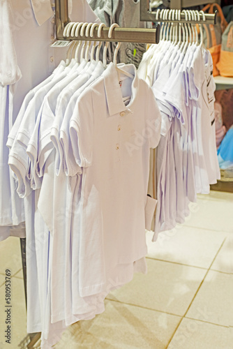 white school polo shirts in the store. back to school