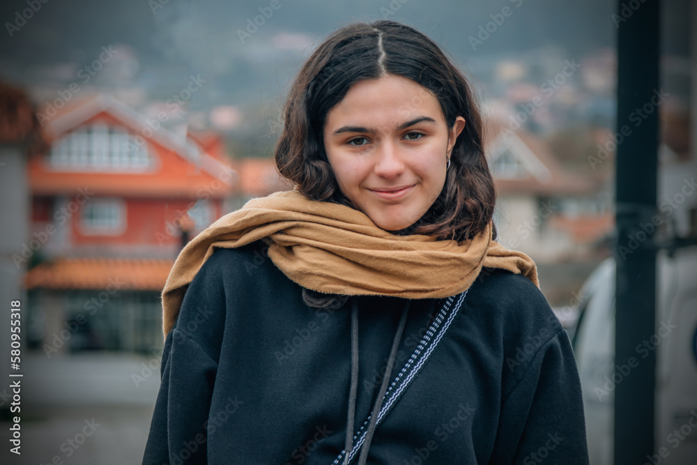 portrait of young teenager with a scarf on the street portrait of young teenager with a scarf on the street