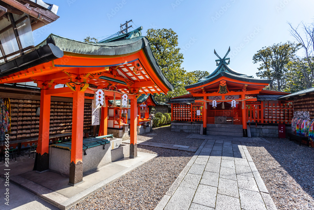 Red torii along a path at the Fushimi Inari shrine in Kyoto. Red torii along a path at the Fushimi Inari shrine in Kyoto.