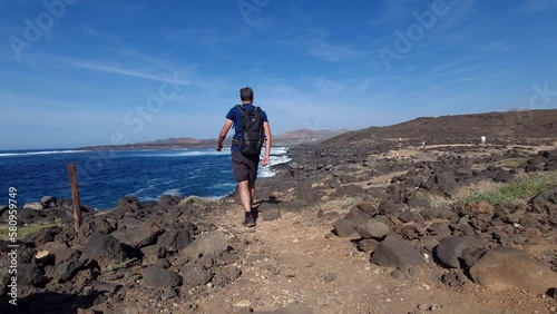 Hiking at the wild coast of Lanzarote sea rocks photo