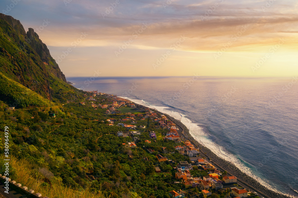 Sunset over Paul Do Mar coastal village in the Madeira Islands, Portugal