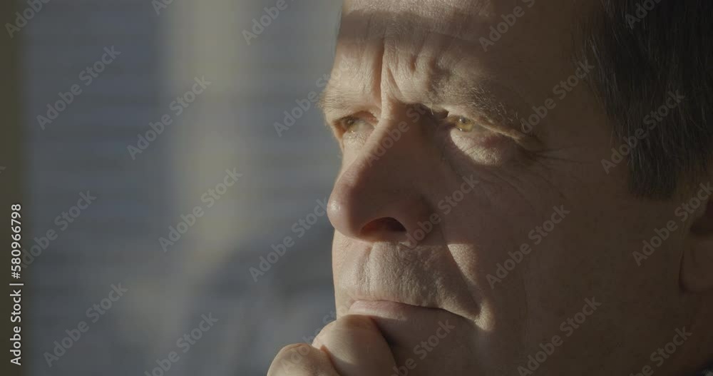 Close shot of sceptic troubled senior man saying no, disapproving and shaking head