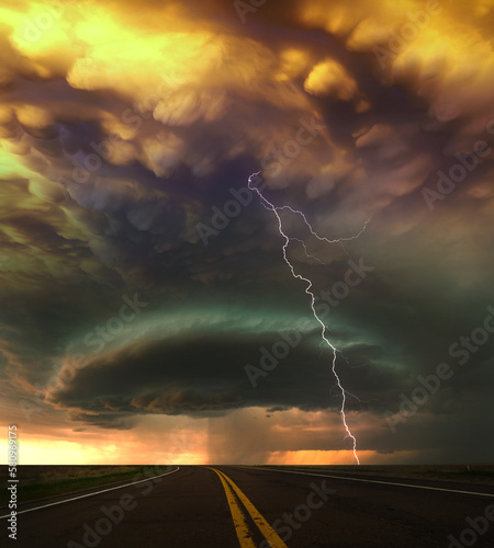 lightning and thunderstorm over a road