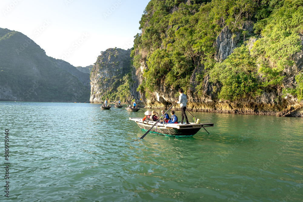Tourists visit on Ha Long Bay in Quang Ninh province, Vietnam Tourists visit on Ha Long Bay in Quang Ninh province, Vietnam