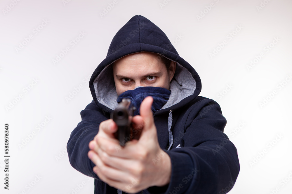 A gun pointed at a person. Bank robbery, man with a gun to rob the victim. gun threat A gun pointed at a person. Bank robbery, man with a gun to rob the victim. gun threat