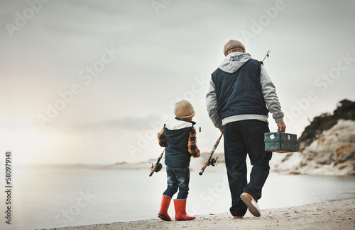 Photos Walking, back and child with grandfather for fishing, bonding and learning to catch fish at the beach