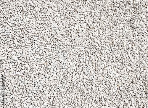 Natural background. Background of white sea stones. Marble chips. White pebbles. View from above. Natural stone background. Copy space