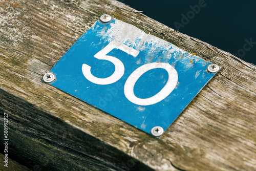 Nissan river wooden quay numeration plates in Halmstad, Sweden. Number 50.