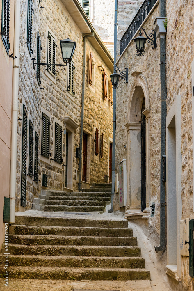 Cozy old narrow street with steps in the Old town of Herceg Novi