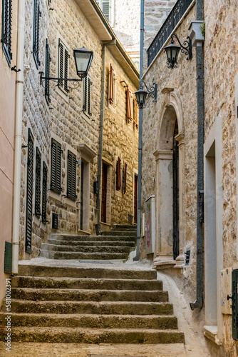 Fototapeta Naklejka Na Ścianę i Meble -  Cozy old narrow street with steps in the Old town of Herceg Novi