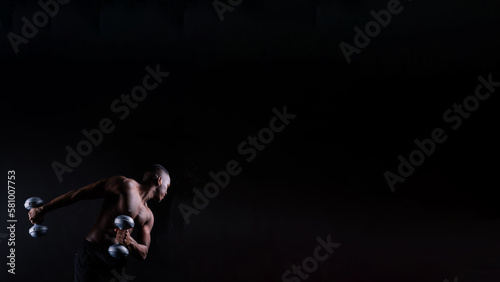 Muscular black african man with defined muscles abs abdominal, exercise determination and success photo