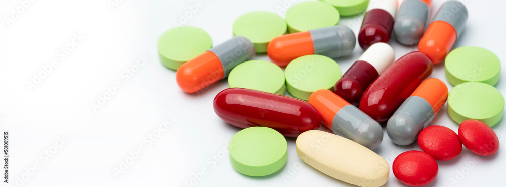 Tablets pills and capsule pills on white background. Drugs, vitamins, minerals, and supplements interactions. Prescription drug. Health care and medicine. Pharmacy products. Drug use in senior people. Tablets pills and capsule pills on white background. Drugs, vitamins, minerals, and supplements interactions. Prescription drug. Health care and medicine. Pharmacy products. Drug use in senior people.
