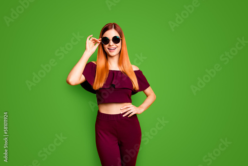 People person youngster youth modern outfit clothes concept. Studio photo portrait of pretty attractive stunning pretty with toothy beaming smile lady adjusting glassed isolate background