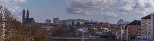 Hazy skyline over the districts Södermalm and Hammarby, churches and the Globen arena Avicii, a snowy sunny spring day in Stockholm