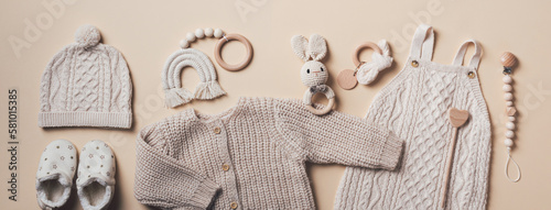 Slika na platnu Set of baby stuff and accessories for newborn on brown background