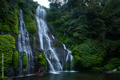 Beautiful Banyumala Twin Waterfall which is located in Wanagiri  Sukasada  Buleleng  Bali  Indonesia. A natural tall waterfall with lots of plants on the rocks with a natural pool at the bottom.