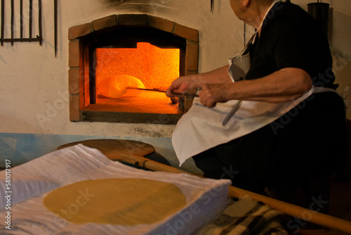 preparation of Sardinian Pane Carasau, Carasau bread, traditional crispy bread of Sardinia, Italy
 photo