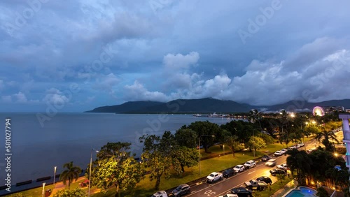 Day-to-night time lapse of Cairns esplanade traffic and clouds rolling in photo