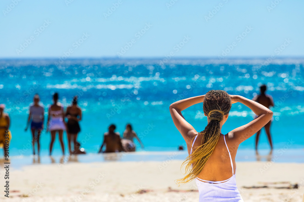 Young African female vacationers on Cape Town beach