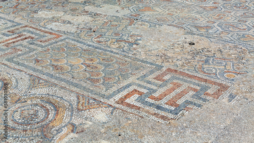 Archaeological remains with decorative tile floors and frescoes paintings in a hillside house on the slopes of the ancient city ruins of Ephesus, Turkey near Selcuk.