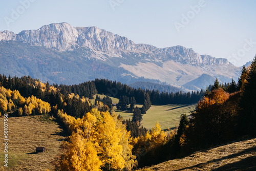 Landscape view over hills and mountains, on a warm autumn sunny day.