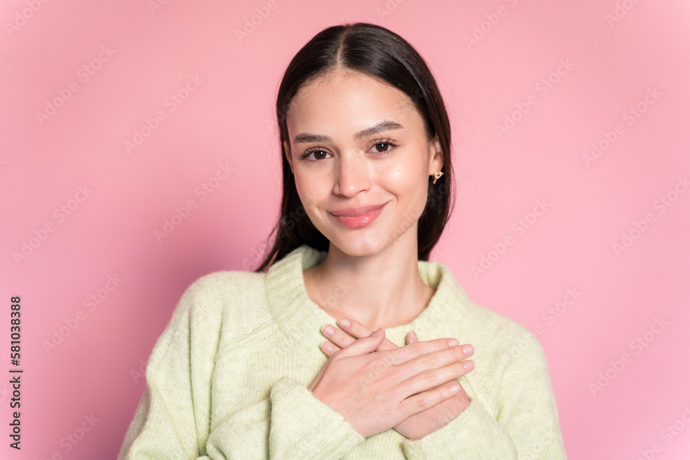 Smiling woman touching chest and looking at camera and looking at camera Smiling woman touching chest and looking at camera and looking at camera