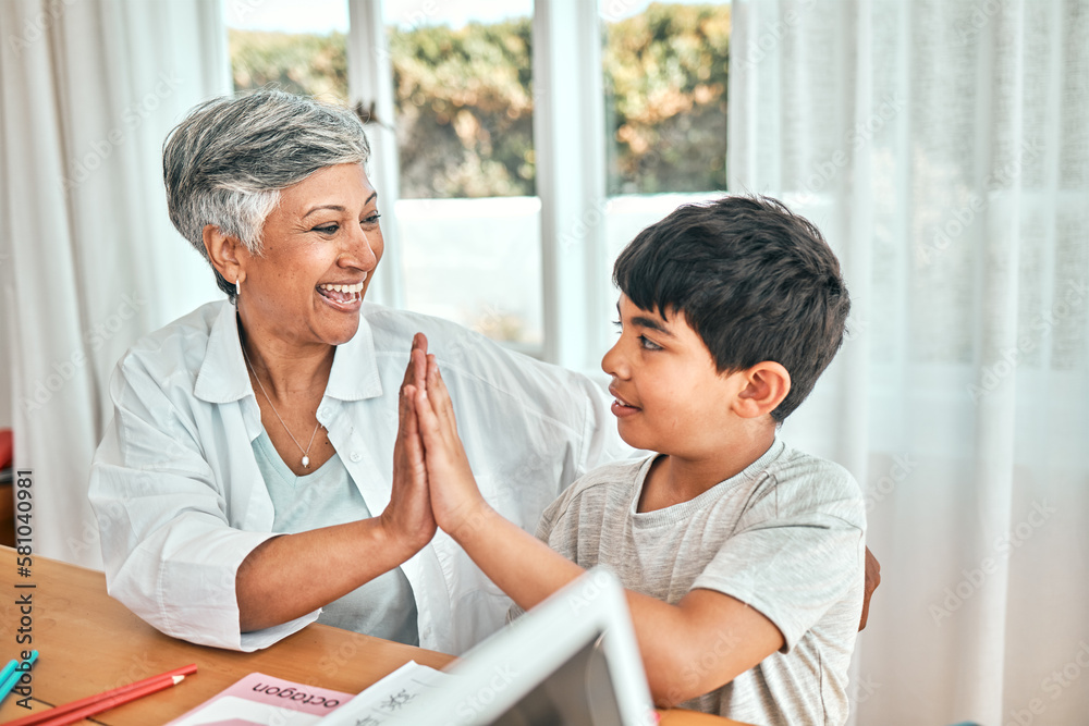 Happy learning, high five and child education development at home with grandparent teacher. Teaching, elderly woman help and homework achievement hand gesture of a senior person and kid at a house Happy learning, high five and child education development at home with grandparent teacher. Teaching, elderly woman help and homework achievement hand gesture of a senior person and kid at a house