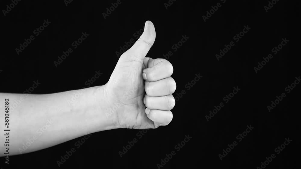 Thumbs up in monochrome, in studio Chiangmai Thailand. Thumbs up in monochrome, in studio Chiangmai Thailand.