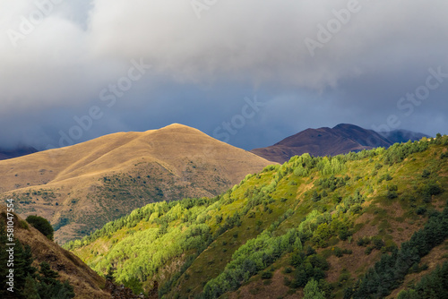 Highlands of North Ossetia. Mountains of the Caucasus. High mountains in the rays of the setting sun.