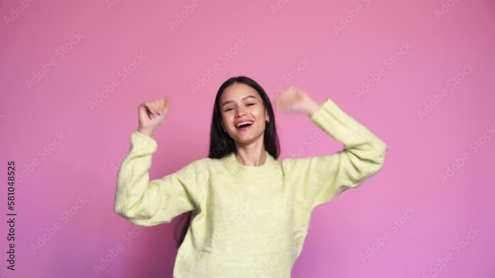 Smiling happy woman dancing and looking at camera Smiling happy woman dancing and looking at camera