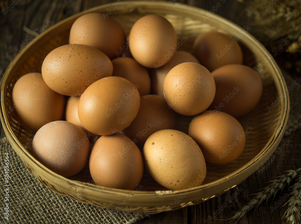 eggs on a rustic background in a wicker bowl eggs on a rustic background in a wicker bowl