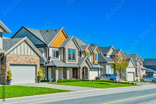 A perfect neighborhood of family houses in suburban area of Vancouver photo