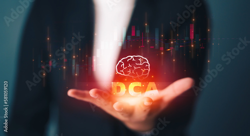 Fotografie Business Woman holding of the dollar cost average icon and investment graph , How To DCA device the best choice to control investment financial and guarantee worthwhile return, high risk high return