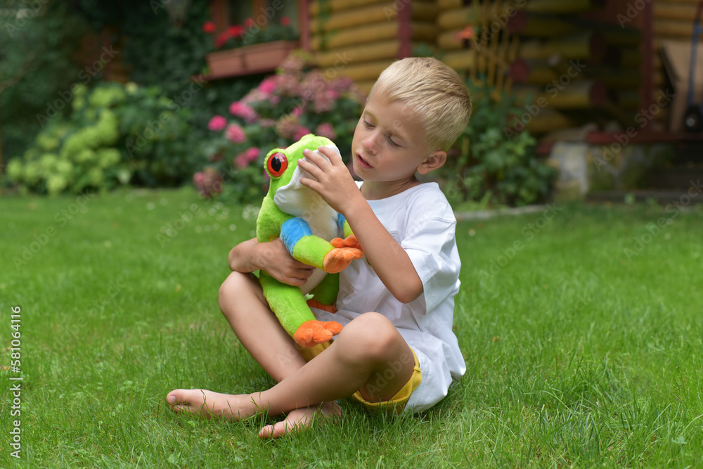 Cheerful boy playing with a toy Cheerful boy playing with a toy