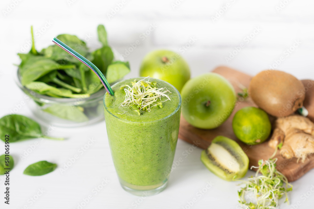 smoothie of micro-green apples cucumber and spinach on a light background. eco organic fresh food detox . ingredients fresh micro-greens . smoothie of micro-green apples cucumber and spinach on a light background. eco organic fresh food detox . ingredients fresh micro-greens .