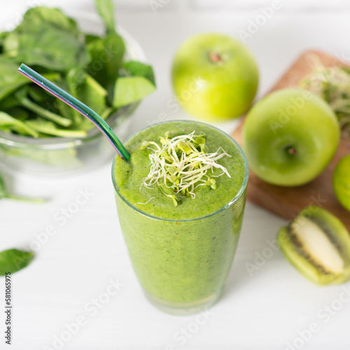 smoothie of micro-green apples cucumber and spinach on a light background. eco organic fresh food detox .