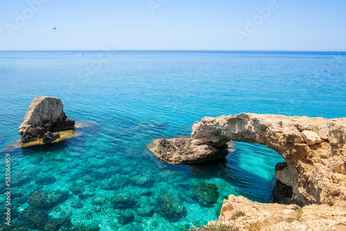 Love bridge near Ayia Napa in Cyprus. Natural rock arch formation known as Bridge of Lovers at Cape Greco. Sea caves on coastline between Agia Napa and Cavo Greco National park