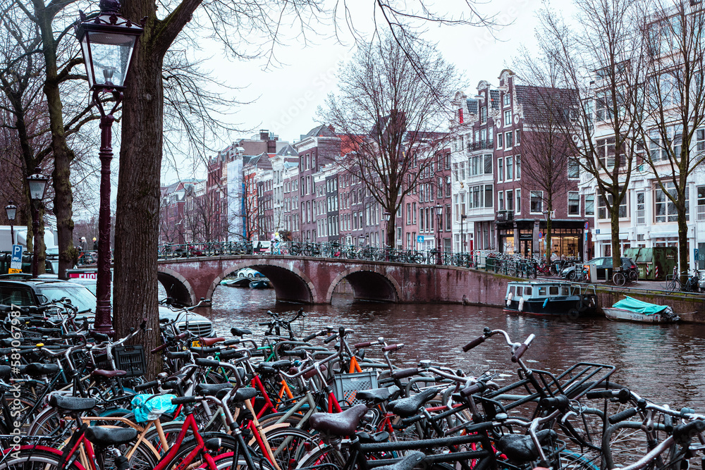 Amsterdam Canal and Houses City Centre with bicycles Iconic bridges and infrastructure 
