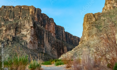 Cliffs rise steeply from Rio Grande River. A view of Santa Elena Canyon in Big Bend National Park.