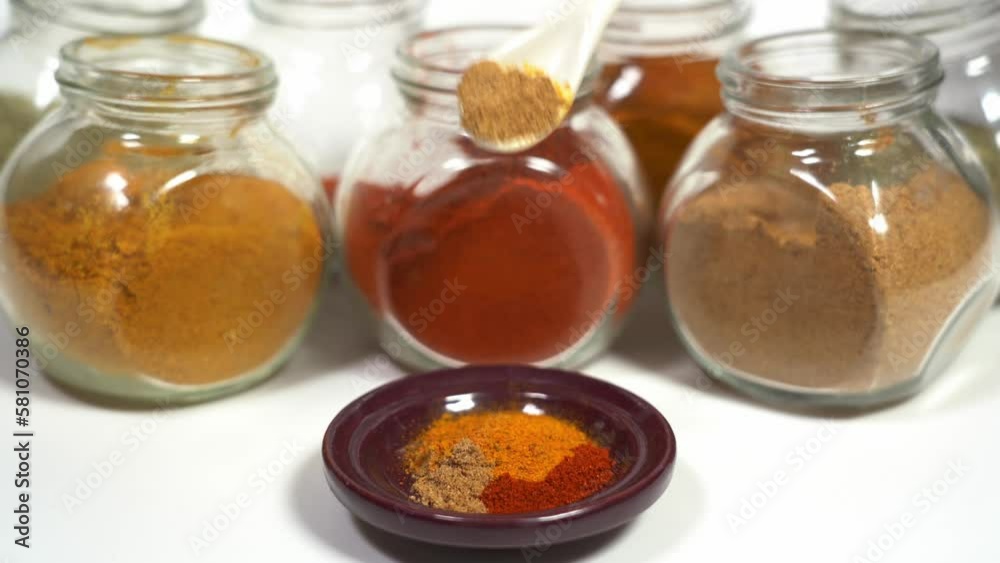 Spices for cooking - Cumin, paprika, curry, turmeric, chilli pepper, pepper, salt, ginger are typical spices of African Moroccan Indian cuisine - health and well-being in kitchen - Mediterranean diet Spices for cooking - Cumin, paprika, curry, turmeric, chilli pepper, pepper, salt, ginger are typical spices of African Moroccan Indian cuisine - health and well-being in kitchen - Mediterranean diet