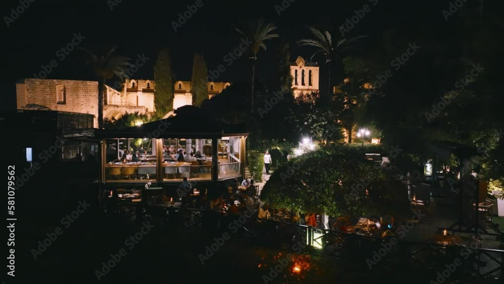 People enjoy dinner at Bellapais Monastery, North Cyprus
