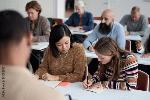 Group of adults sitting in class photo