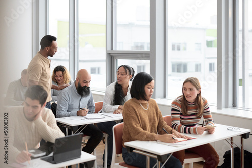 Teacher and adult students in class photo