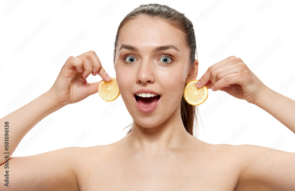 Surprised young beautiful girl with well-kept skin isolated over white studio background. Facial cosmetics masks. Concept of natural beauty, skincare, cosmetology, health, ad Surprised young beautiful girl with well-kept skin isolated over white studio background. Facial cosmetics masks. Concept of natural beauty, skincare, cosmetology, health, ad