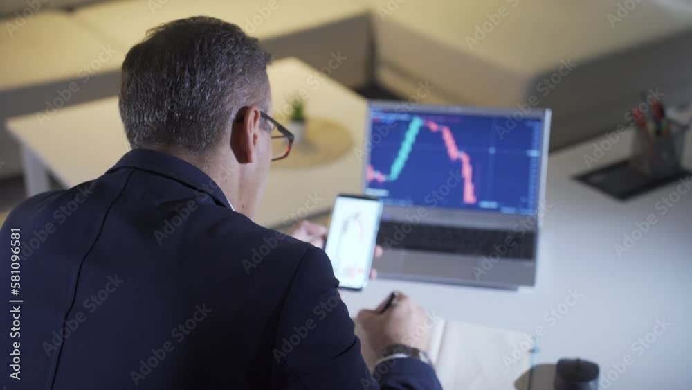 Man analyzing stock market and cryptocurrency charts from laptop.
Man taking notes from laptop to stock market, stock, analyzing investment charts.
Man analyzing stock market and cryptocurrency charts from laptop.
Man taking notes from laptop to stock market, stock, analyzing investment charts.