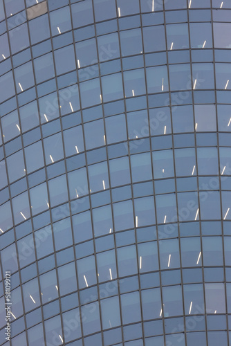 Grey glass and steel frame of modern skyscraper glass wall. Industrial background and texture