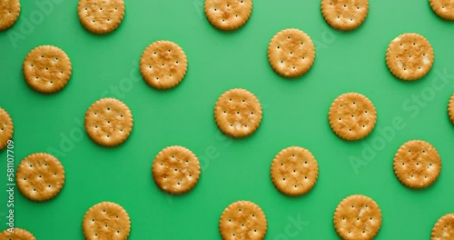 Cookie pattern on a green background. Looped 4k stop motion animation photo