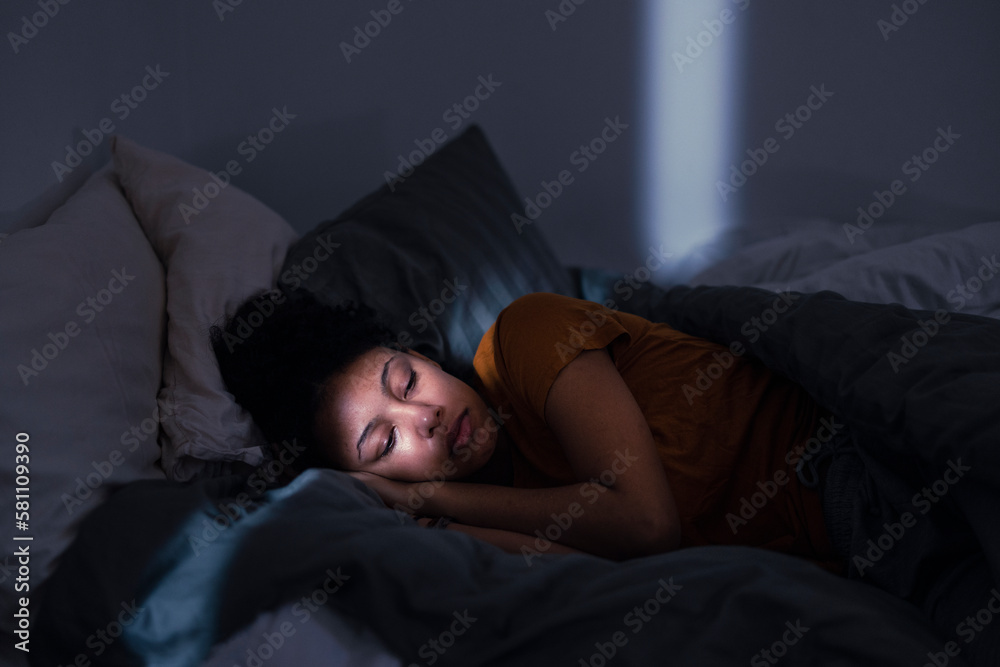 Pensive young woman lying in bed Pensive young woman lying in bed