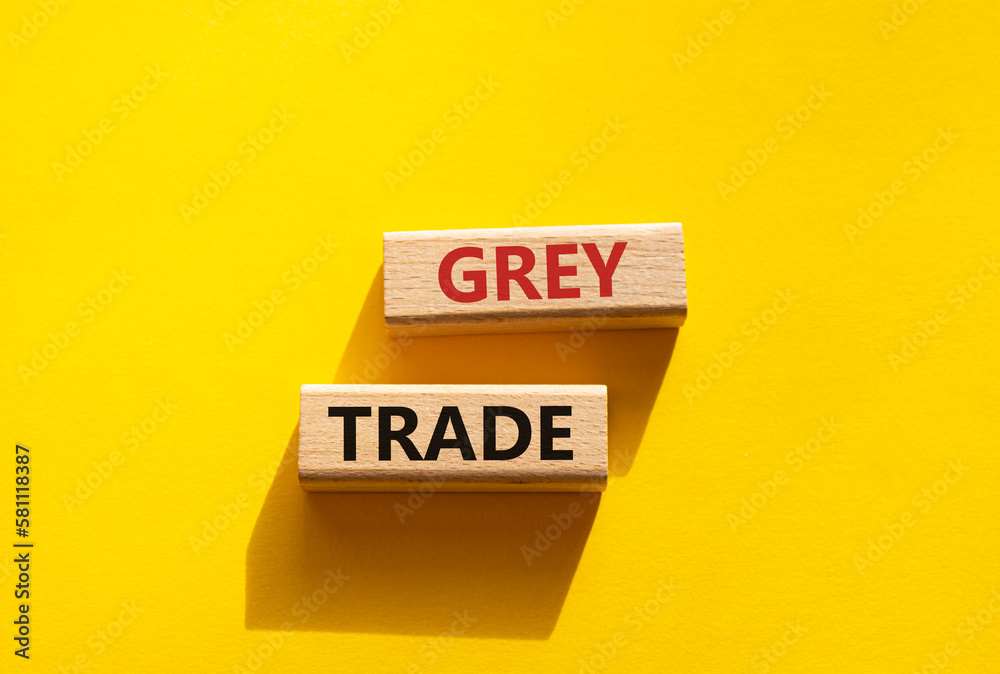 Grey trade symbol. Wooden blocks with words grey trade. Beautiful yellow background. Business and grey trade concept. Copy space. Grey trade symbol. Wooden blocks with words grey trade. Beautiful yellow background. Business and grey trade concept. Copy space.