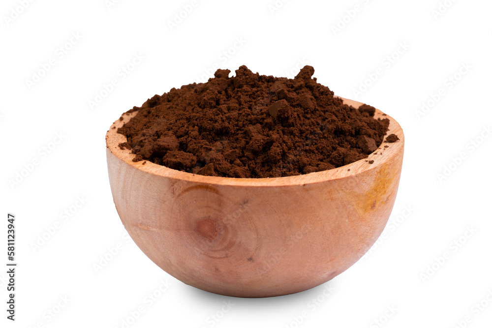 Coffee grounds in a wooden bowl isolated on white background.